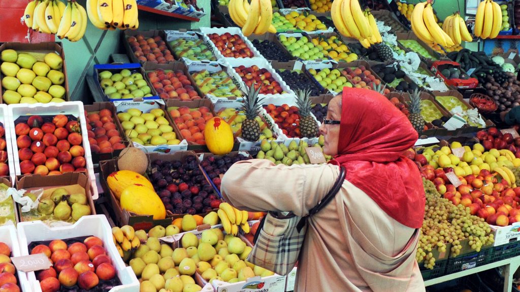 A customer waits to be served at a fruit